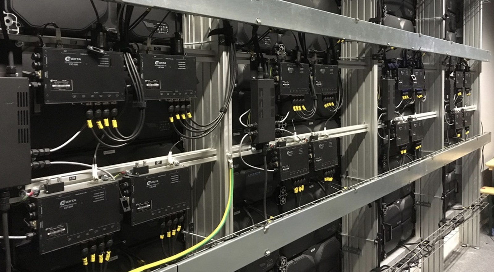 Rear of a TRUE dvLED wall: LSC signal converters with every cable numbered and clipped, the way TRUE crews wire a wall
